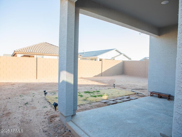 view of yard featuring a patio area and a fenced backyard