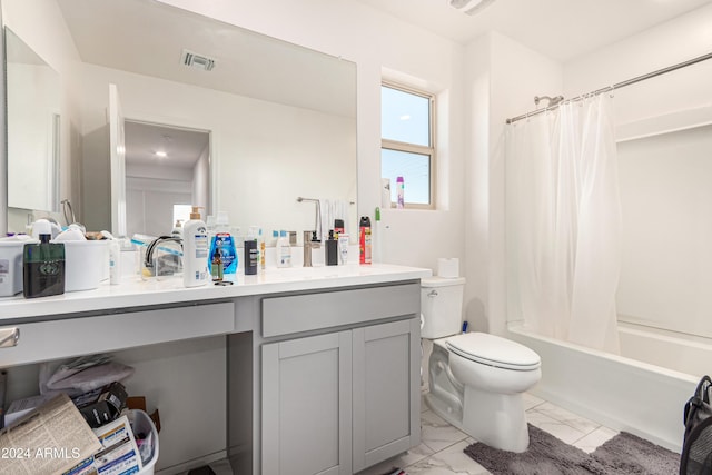 full bathroom featuring toilet, vanity, and shower / tub combo with curtain