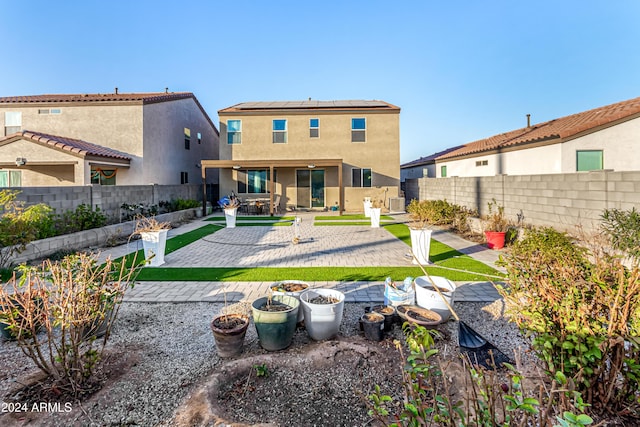 rear view of property featuring a patio area