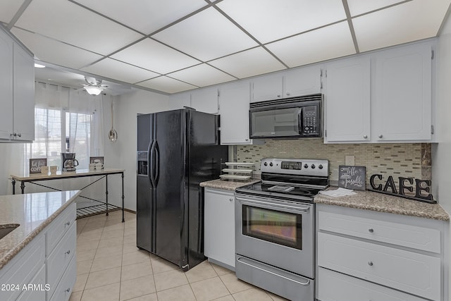 kitchen featuring black appliances, white cabinetry, backsplash, and light tile patterned floors