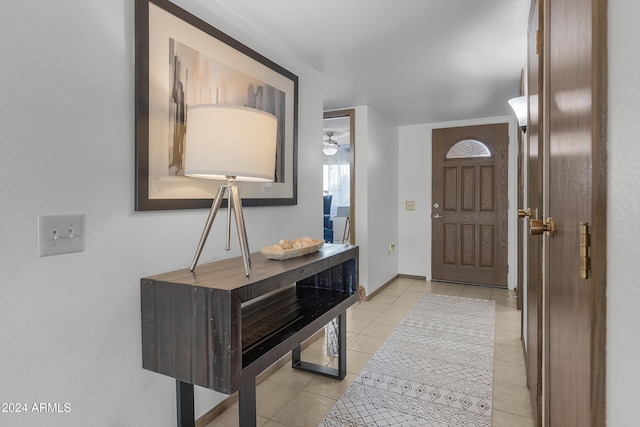 tiled entrance foyer featuring ceiling fan