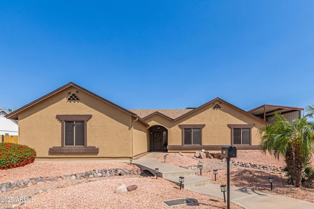view of front of home featuring stucco siding