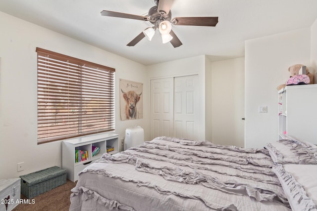 carpeted bedroom with a closet and ceiling fan
