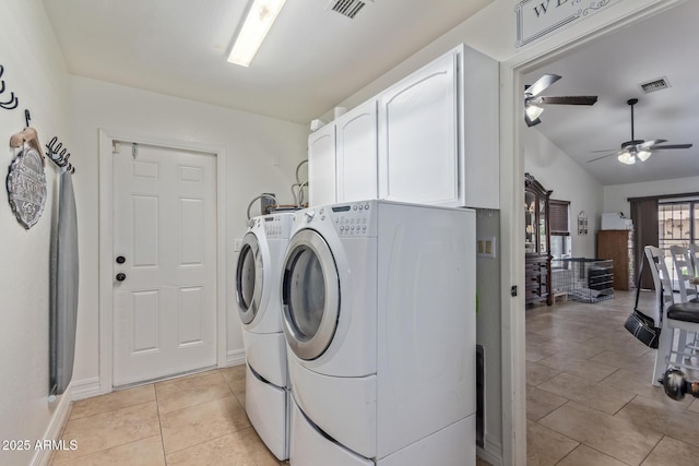 washroom featuring light tile patterned floors, washing machine and clothes dryer, visible vents, a ceiling fan, and cabinet space