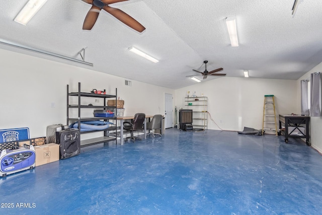 garage featuring a ceiling fan and visible vents