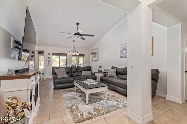 living room with baseboards, light tile patterned floors, vaulted ceiling, and a ceiling fan