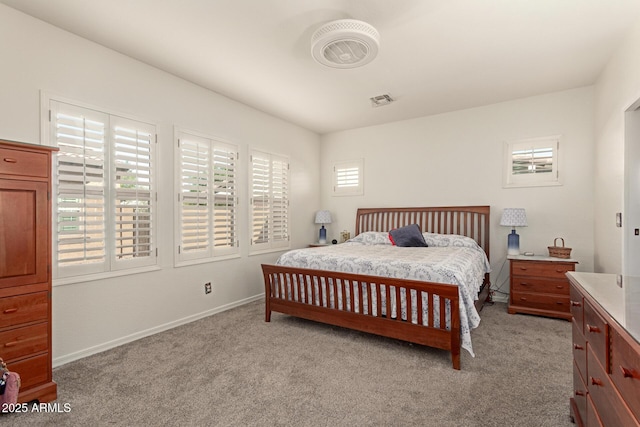 bedroom featuring light carpet, baseboards, and visible vents