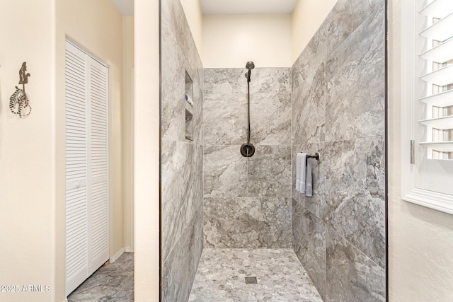 full bathroom with tiled shower