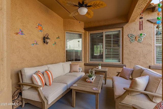view of patio / terrace with a ceiling fan and an outdoor hangout area