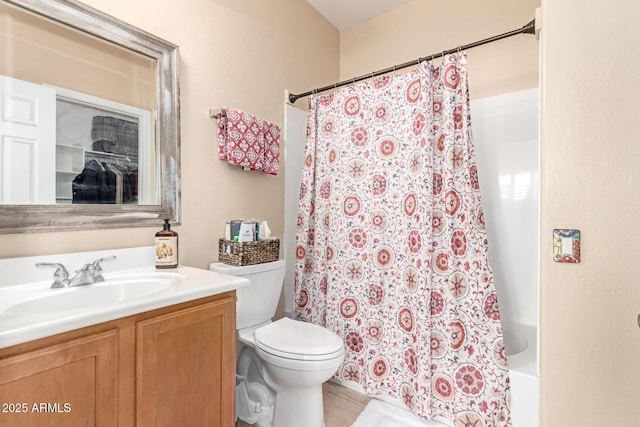 bathroom featuring shower / tub combo, vanity, tile patterned flooring, and toilet