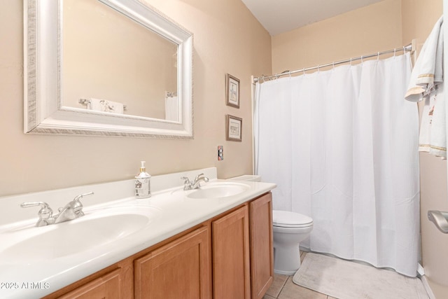 full bath featuring toilet, tile patterned flooring, a sink, and double vanity