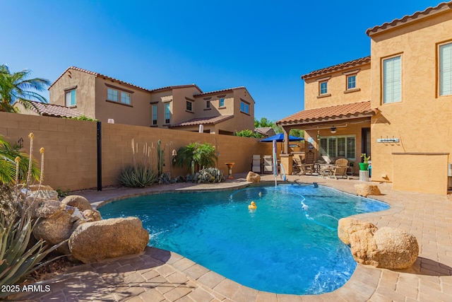 view of pool with a patio area, a fenced backyard, a fenced in pool, and ceiling fan