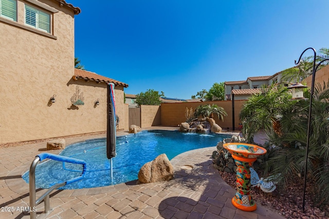 view of pool featuring a patio area, a fenced backyard, and a fenced in pool