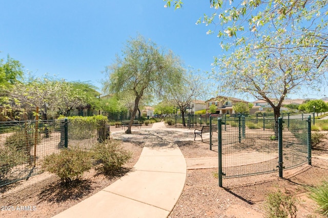 view of property's community featuring fence