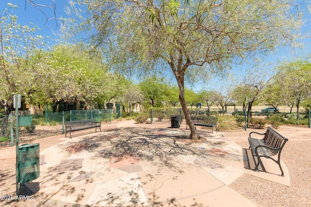 view of property's community featuring fence