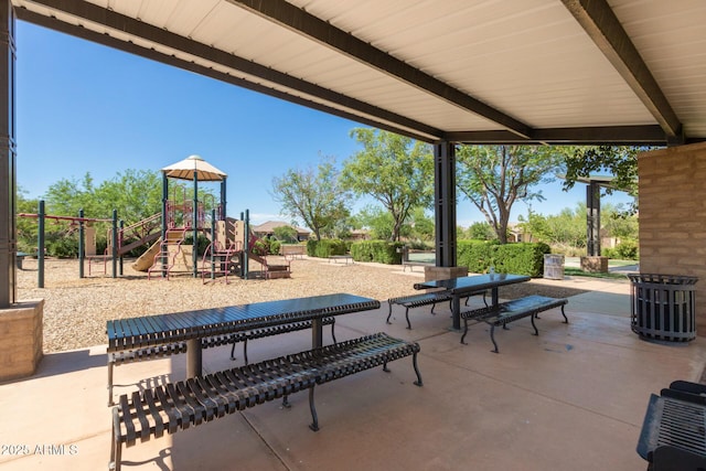 view of patio featuring playground community