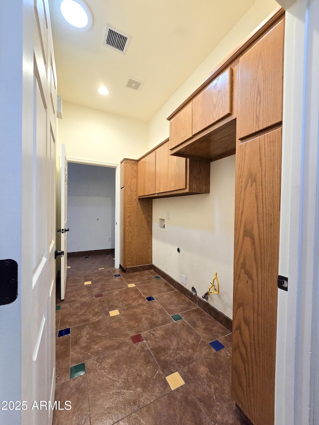 kitchen featuring light brown cabinets