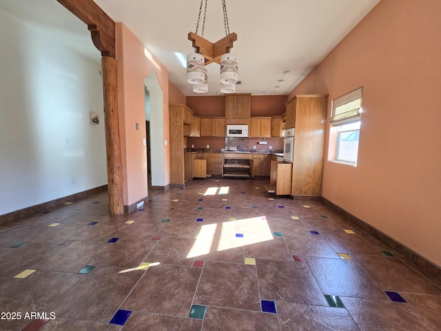 kitchen featuring hanging light fixtures and oven