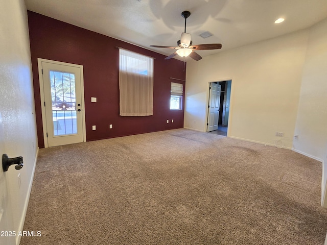 spare room with ceiling fan and carpet flooring