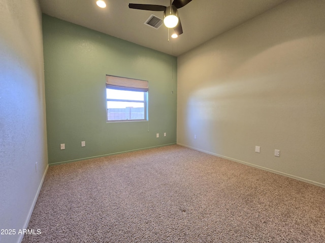 spare room featuring ceiling fan and carpet flooring