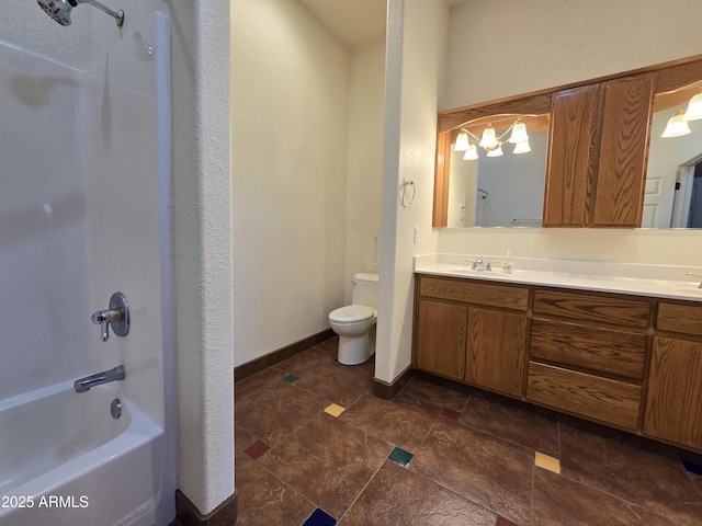 full bathroom featuring toilet, vanity, and bathing tub / shower combination