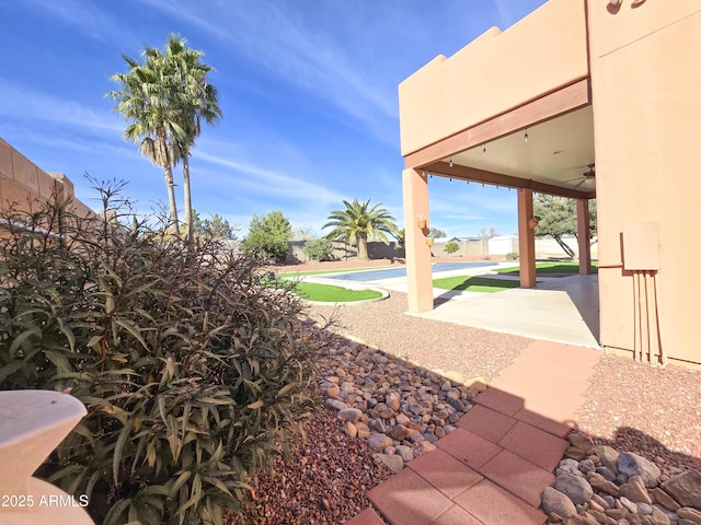 view of yard featuring a patio area and a pool