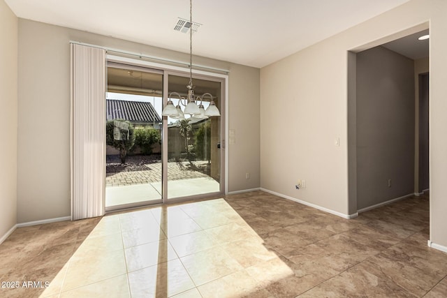 unfurnished dining area with baseboards, visible vents, and a notable chandelier