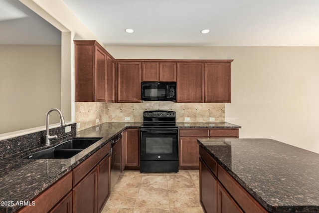 kitchen featuring recessed lighting, decorative backsplash, a sink, dark stone countertops, and black appliances