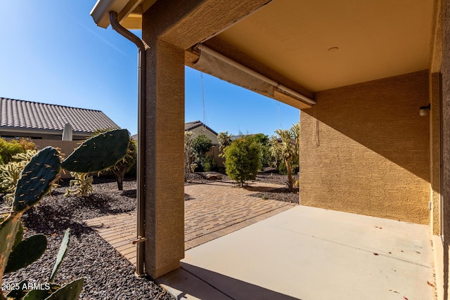 view of patio / terrace featuring fence