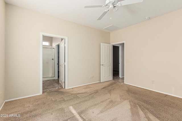 unfurnished bedroom featuring ensuite bathroom, carpet, a ceiling fan, and baseboards