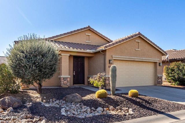 view of front of home featuring an attached garage, stone siding, concrete driveway, a tiled roof, and stucco siding