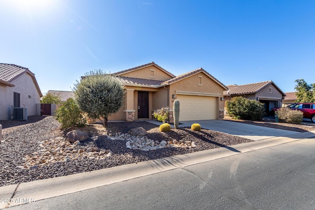 ranch-style house with a garage, stone siding, central AC, and driveway