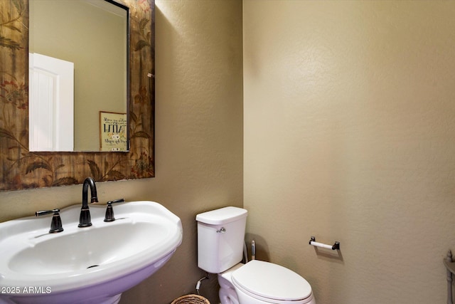 3944 W Paradise Ln, Phoenix, AZ 85053 - half bathroom featuring a sink and toilet