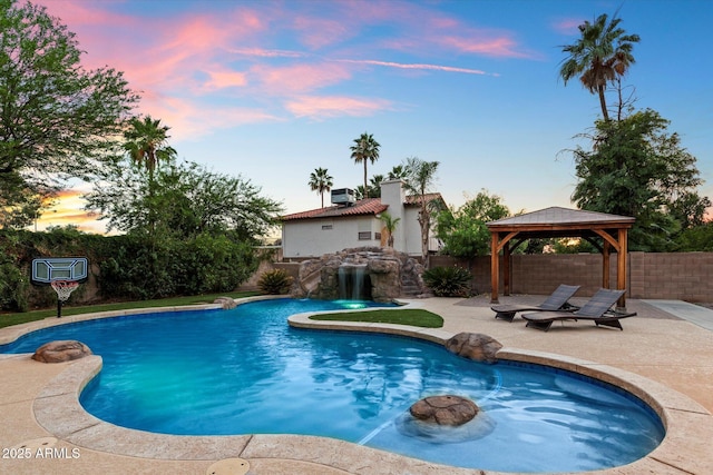 3944 W Paradise Ln, Phoenix, AZ 85053 - view of pool with a gazebo, a patio, and a fenced backyard