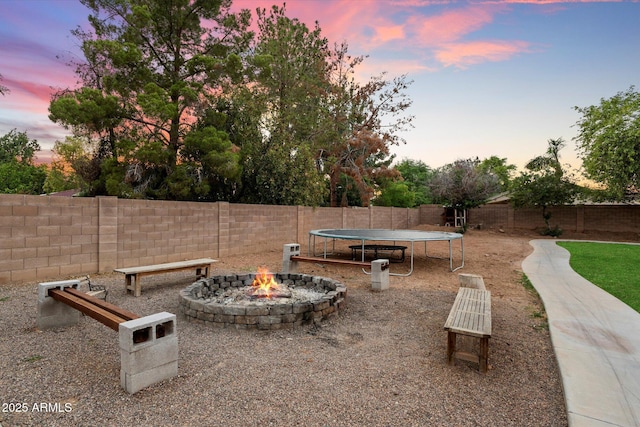 3944 W Paradise Ln, Phoenix, AZ 85053 - fenced backyard with a trampoline and a fire pit