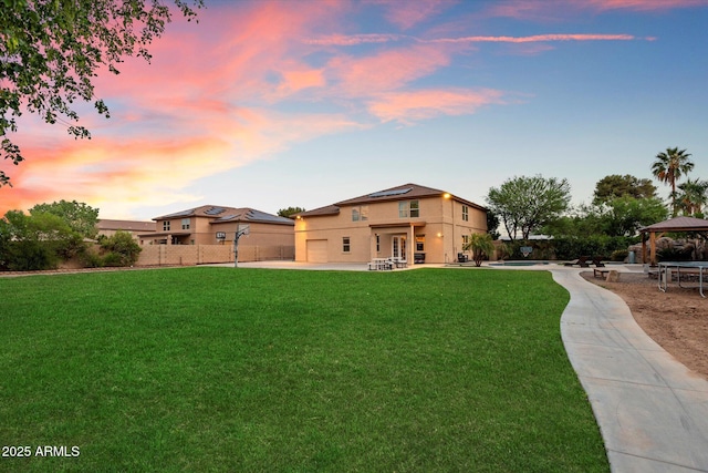 3944 W Paradise Ln, Phoenix, AZ 85053 - yard at dusk featuring a gazebo and a patio area