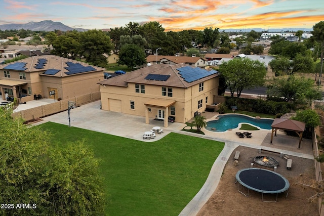 3944 W Paradise Ln, Phoenix, AZ 85053 - aerial view of residential area with a mountain backdrop and a pool area