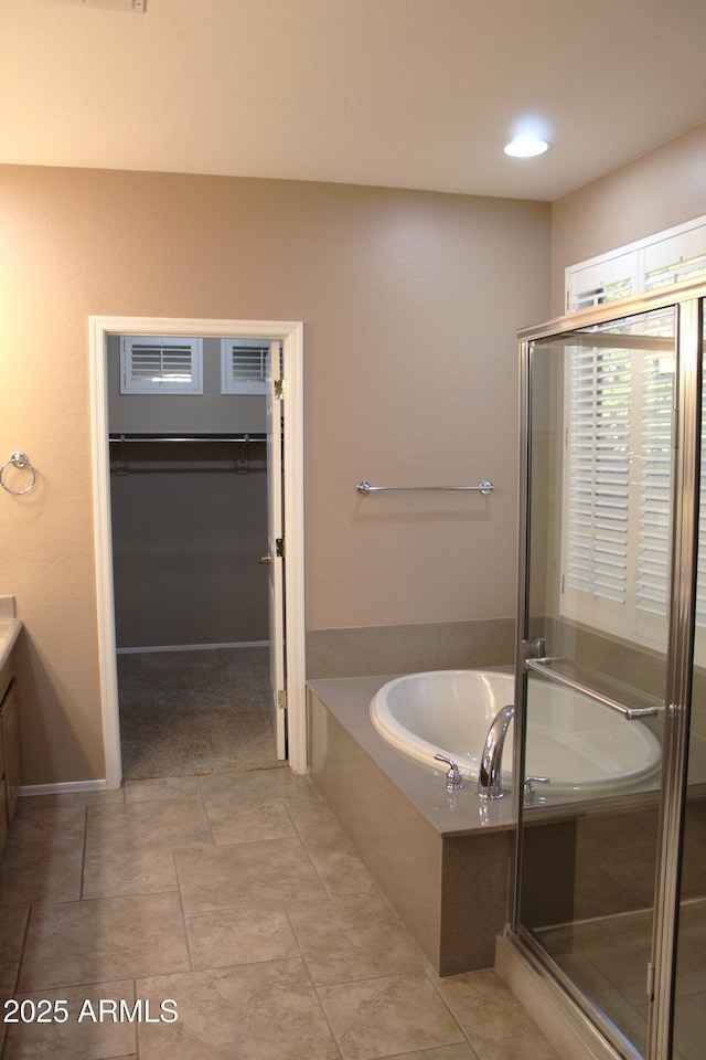 bathroom with vanity, tile patterned floors, and shower with separate bathtub