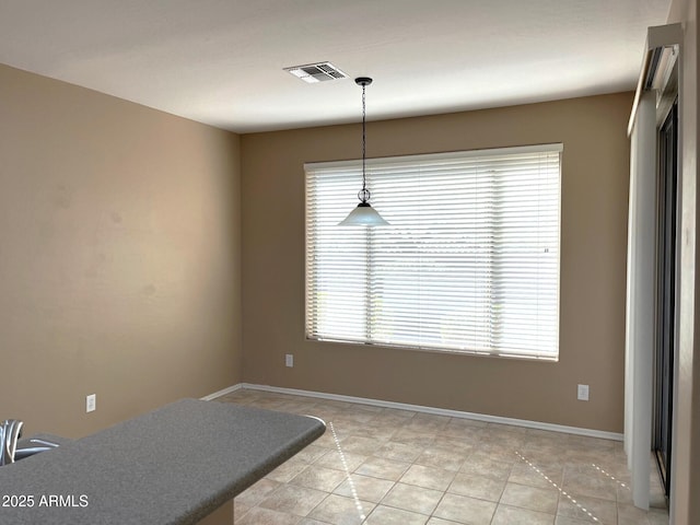 dining room with light tile patterned flooring