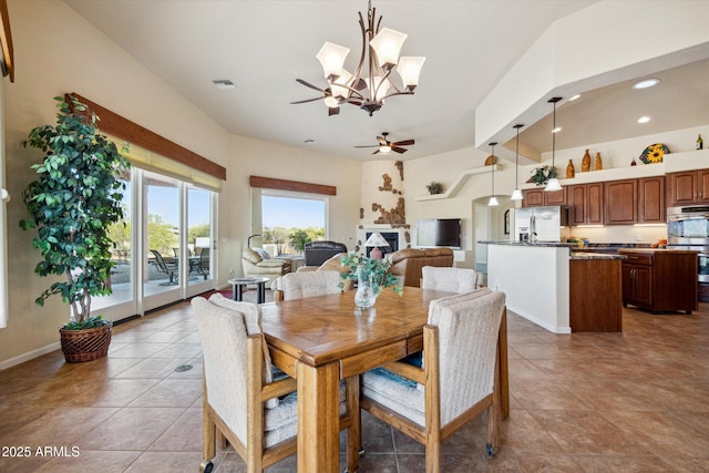 tiled dining area featuring recessed lighting, ceiling fan with notable chandelier, visible vents, and baseboards