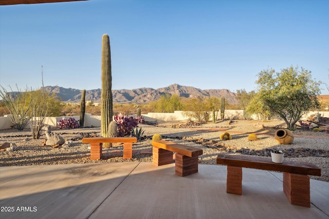 view of patio / terrace with a mountain view