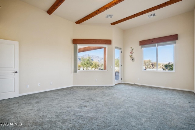 spare room with lofted ceiling with beams, visible vents, carpet floors, and baseboards