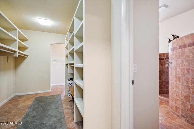 walk in closet featuring visible vents