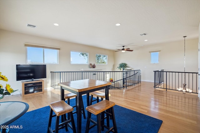 dining space featuring visible vents, recessed lighting, a ceiling fan, and wood finished floors