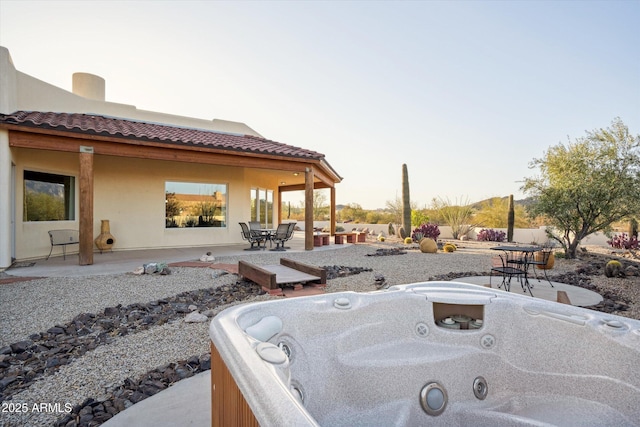 view of patio with a hot tub