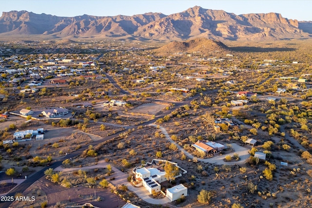 birds eye view of property with a mountain view