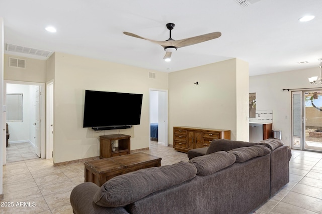 living area featuring a ceiling fan, light tile patterned flooring, a chandelier, recessed lighting, and baseboards