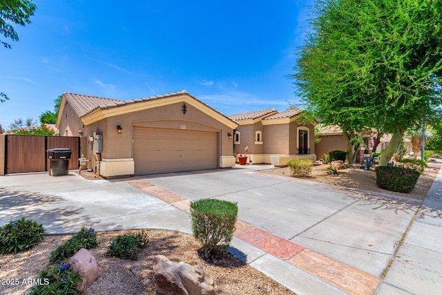 1865 E Locust Pl, Chandler, AZ 85286 - mediterranean / spanish-style home with driveway, stucco siding, a tile roof, and a garage