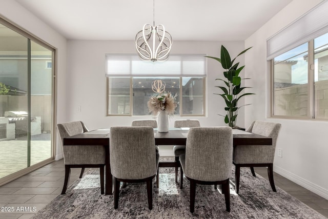 dining space featuring an inviting chandelier