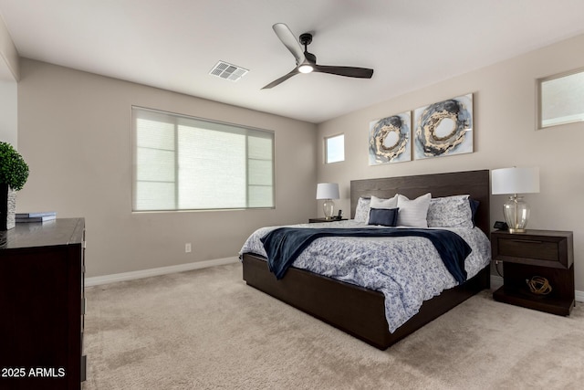 bedroom featuring light carpet and ceiling fan